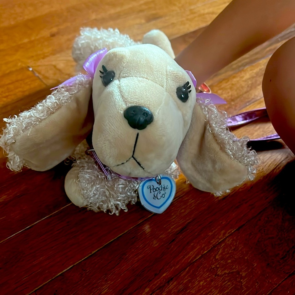 Poochie & Co Blonde Poodle with purple sequined body with pink skirt